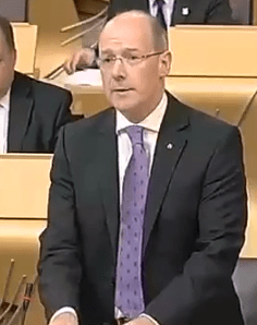 John Swinney elaborated on the draft budget in parliament on 11 September